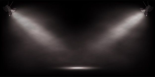 Donker toneel met twee schijnwerpers en een smalle lichtvlek